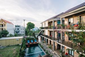 a view from a balcony of a house with a pool at Xuân Anh Homestay in Ninh Binh