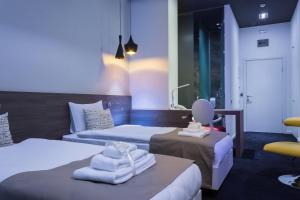 Postel nebo postele na pokoji v ubytování Garni Hotel Eter