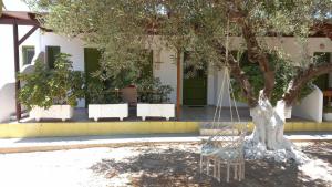 A garden outside Leros Eleonas ApartmentS