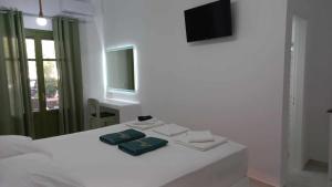 A bed or beds in a room at Leros Eleonas ApartmentS