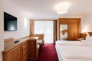 Postel nebo postele na pokoji v ubytování Hotel Ingram