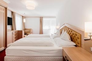 Postel nebo postele na pokoji v ubytování Hotel Ingram
