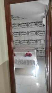 Posteľ alebo postele v izbe v ubytovaní Apartamentos centro histórico