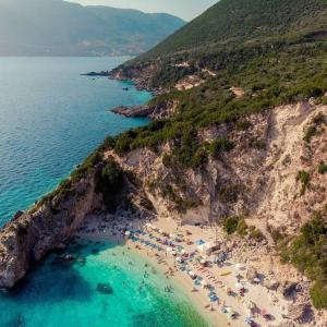 an aerial view of a beach with people on it at Yiampanaki in Vasiliki