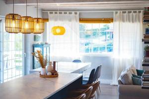 a living room with a dining table and chairs at Las Cerezas Gozón By Silastur in Luanco