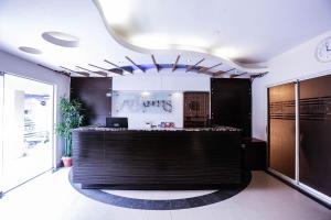 a lobby with a reception desk in a building at Resort Atlantis 