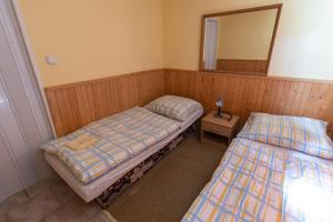 Postel nebo postele na pokoji v ubytování Drevenice Via Vitis