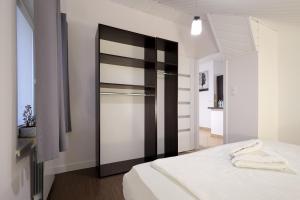 Łóżko lub łóżka w pokoju w obiekcie Dworek Różany Hotel & Restauracja