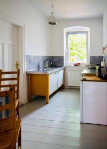 a kitchen with a sink and a window at Landhaus Oderbruch in Bad Freienwalde