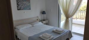 Katil atau katil-katil dalam bilik di Lakithra Apartments