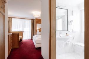 Postel nebo postele na pokoji v ubytování Hotel Ingram