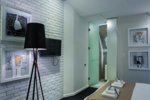 TV a/nebo společenská místnost v ubytování Garni Hotel Eter