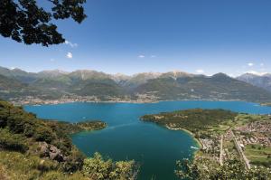 a view of a lake with mountains in the background at Green Village Accommodations in Colico