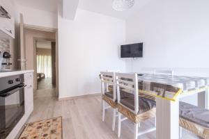 a kitchen with a island with a counter top at Damilhouse 4 in Messina