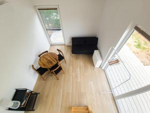 an overhead view of a living room with a table and chairs at Dywanowy Zakątek in Sominy
