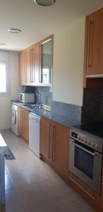 Kuchyň nebo kuchyňský kout v ubytování Apartamento Residencial Deltamar