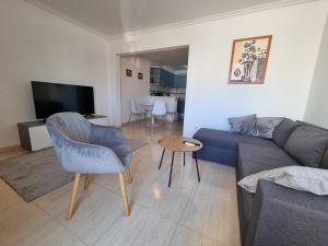 a living room with a couch and a table at Monte Mar Apartment in Gran Alacant