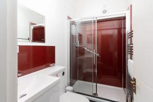 a bathroom with a shower and a toilet and a sink at Room 1, Hotel style twin bedroom in Marazion in Marazion