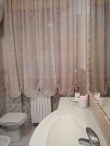 a bathroom with a white toilet and a sink at Sirolo - Pesciolino Azzurro in Sirolo