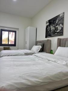 Letto o letti in una camera di Al Artaa Resort