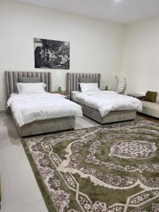 Letto o letti in una camera di Al Artaa Resort