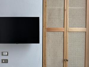 TV a/nebo společenská místnost v ubytování AccalmiA