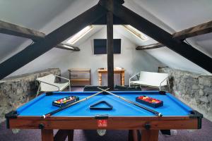 a room with a pool table in a attic at Finest Retreats - Felin Ship in Dolgellau