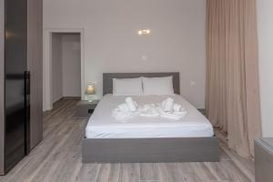 Łóżko lub łóżka w pokoju w obiekcie Medusa Rooms