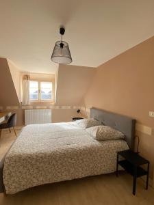 Posteľ alebo postele v izbe v ubytovaní Gîte Les Tazons - Pays de George Sand