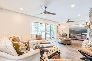 a living room with a couch and a table at Lake Nottely Escape in Mashburn Mill