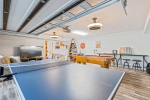 a living room with a ping pong table at Lake Nottely Escape in Mashburn Mill