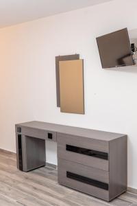 Telewizja i/lub zestaw kina domowego w obiekcie Medusa Rooms