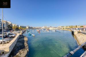 a view of a river with boats in it at Gzira's Seashore Stayaway close to Manuel Island in Il-Gżira