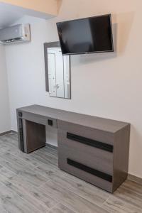 Telewizja i/lub zestaw kina domowego w obiekcie Medusa Rooms