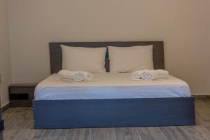 Łóżko lub łóżka w pokoju w obiekcie Medusa Rooms