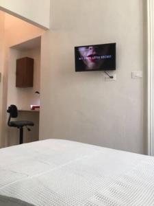Televízia a/alebo spoločenská miestnosť v ubytovaní Casa Principe