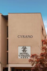 a sign on the side of a building at Hotel Cyrano in Saronno