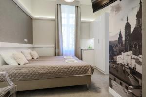 Кровать или кровати в номере Apartamenty Podwale