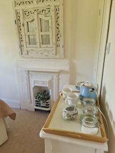 a room with a table with a tea set on it at Home from home in Linton in Linton