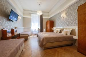 Łóżko lub łóżka w pokoju w obiekcie Apartamenty Podwale