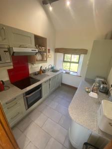 a kitchen with a sink and a counter top at Kennick Barn, peace and quiet guaranteed, Dartmoor in Christow