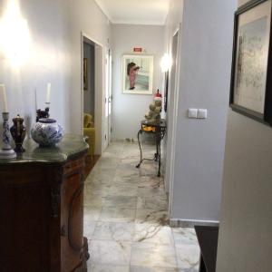 a hallway with a tile floor in a room at Pousada da Vila in Vila Franca do Campo