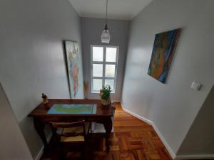 a dining room with a table and a window at Pousada da Vila in Vila Franca do Campo