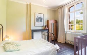 a bedroom with a bed and a window at Le presbytère de Fressin in Fressin +39 photos