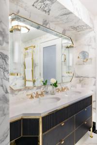 a bathroom with a sink and a mirror at The Westbury Hotel in Dublin