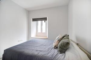 A bed or beds in a room at Marqués de Cádiz Suite Jerez Centro