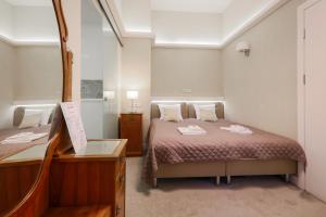Łóżko lub łóżka w pokoju w obiekcie Apartamenty Podwale
