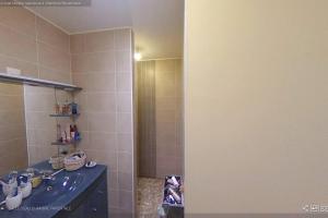 a bathroom with a sink and a shower with a mirror at La maison du bonheur in Biscarrosse