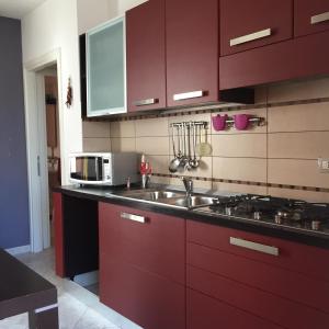 Atene Apartment tesisinde mutfak veya mini mutfak