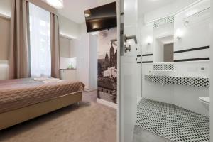 Łóżko lub łóżka w pokoju w obiekcie Apartamenty Podwale